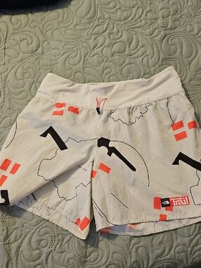 The North Face White Athletic Trail Shorts with Coral Accents
